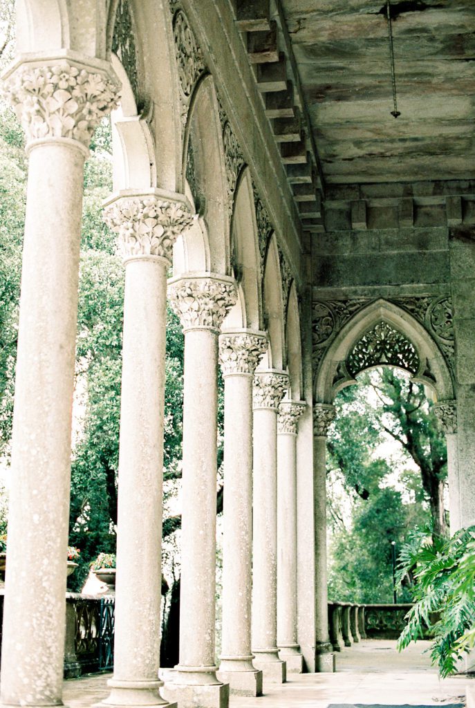 Veranda of Portugal wedding venue with tall ornate pillars and gothic style  detailed archways.