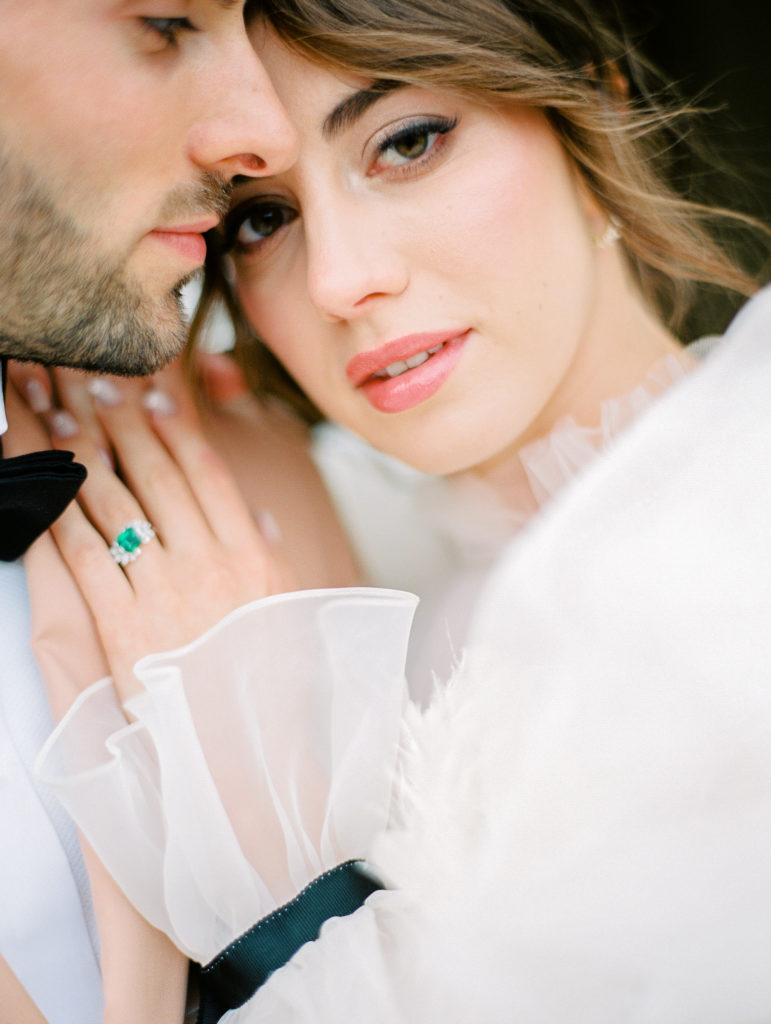 Wedding at the Ritz Paris with emerald green wedding ring, lace gown, feather gown, peach dinner jacket and intimate photos
