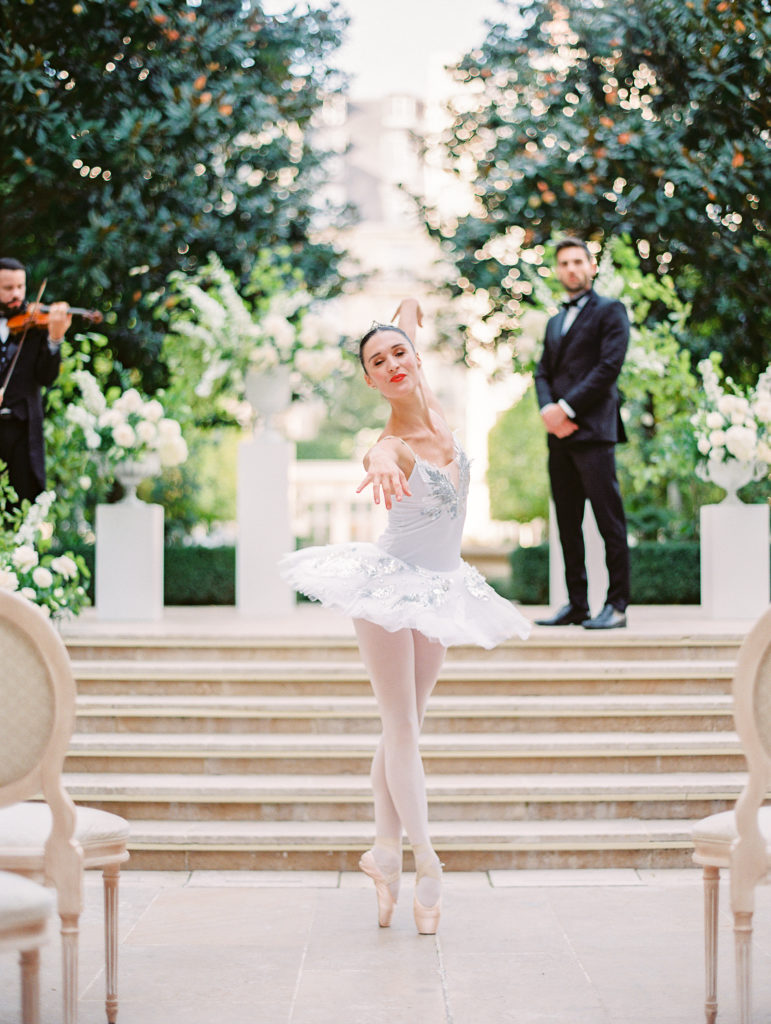Ballerina dancing down the aisle of a wedding ceremony at the Ritz Paris
