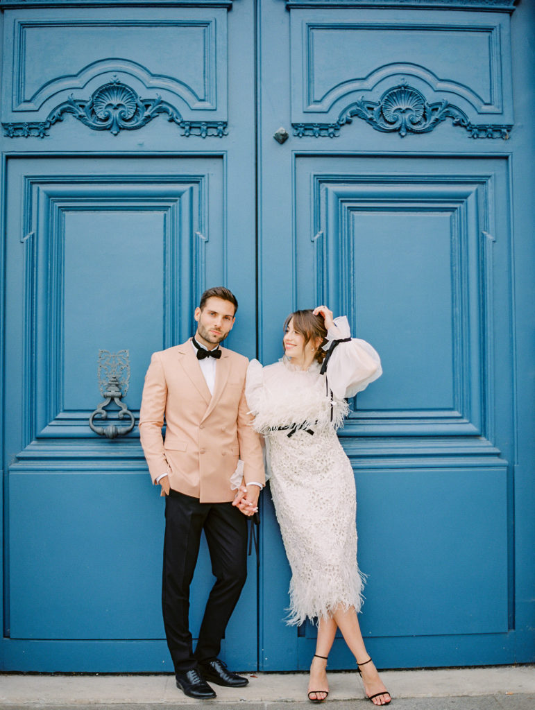 Wedding at the Ritz Paris with emerald green wedding ring, lace gown, feather gown, peach dinner jacket and intimate photos