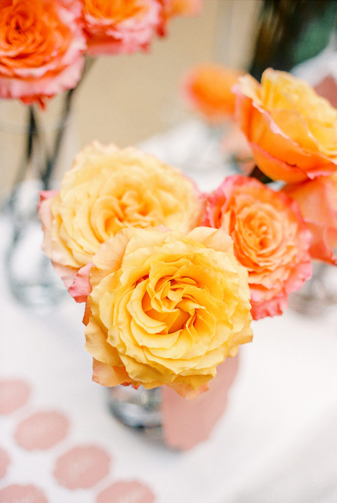 Wedding Reception at Ritz Paris with vibrant coral and yellow garden roses.