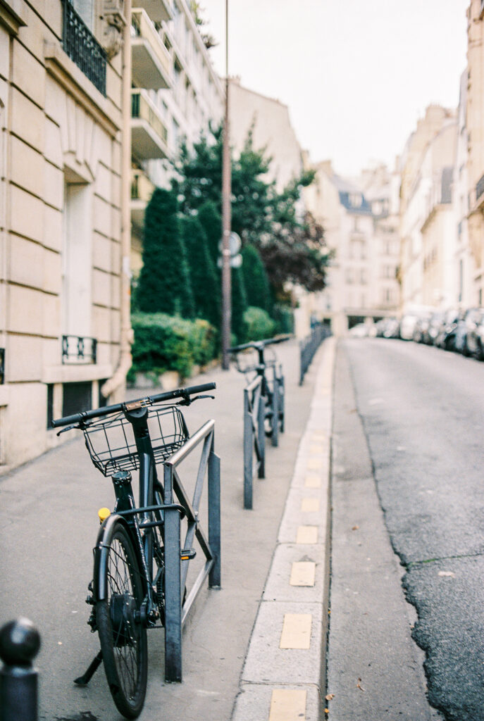 Bicycles lining the sidewalk of Paris France