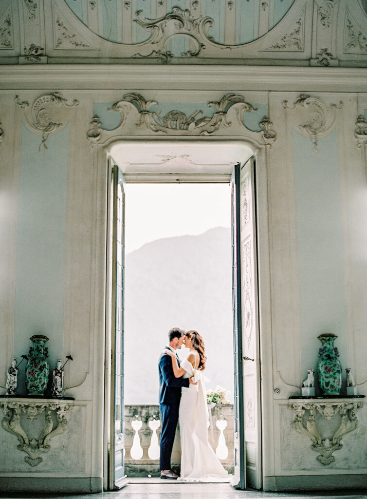 Villa Sola Cabiati Wedding with bride in off the shoulder fitted gown and groom in navy blue suit