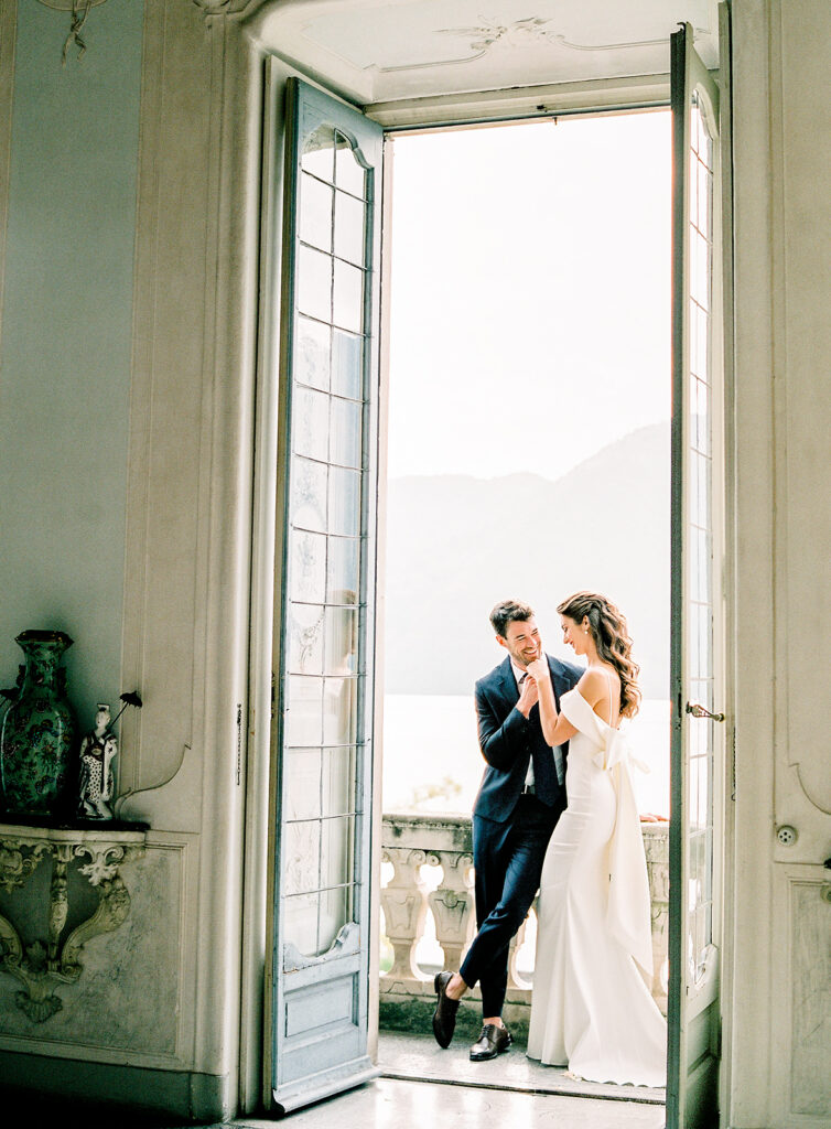 Villa Sola Cabiati Wedding with bride in off the shoulder fitted gown and groom in navy blue suit