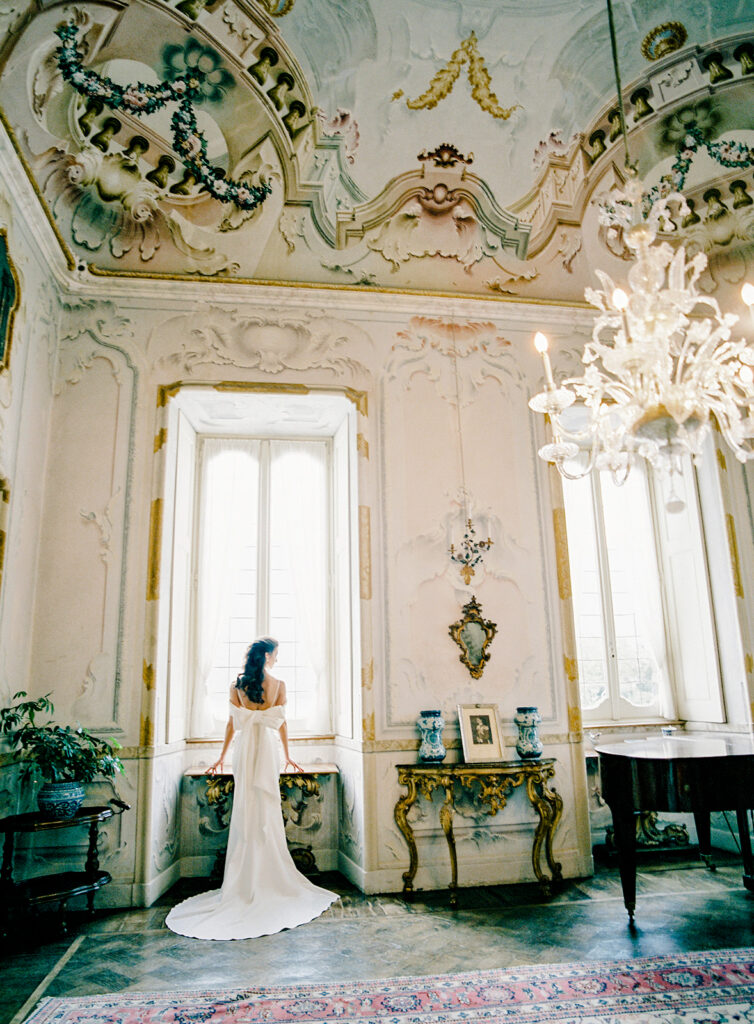 Villa Sola Cabiati Wedding with bride in off the shoulder fitted gown and groom in navy blue suit
