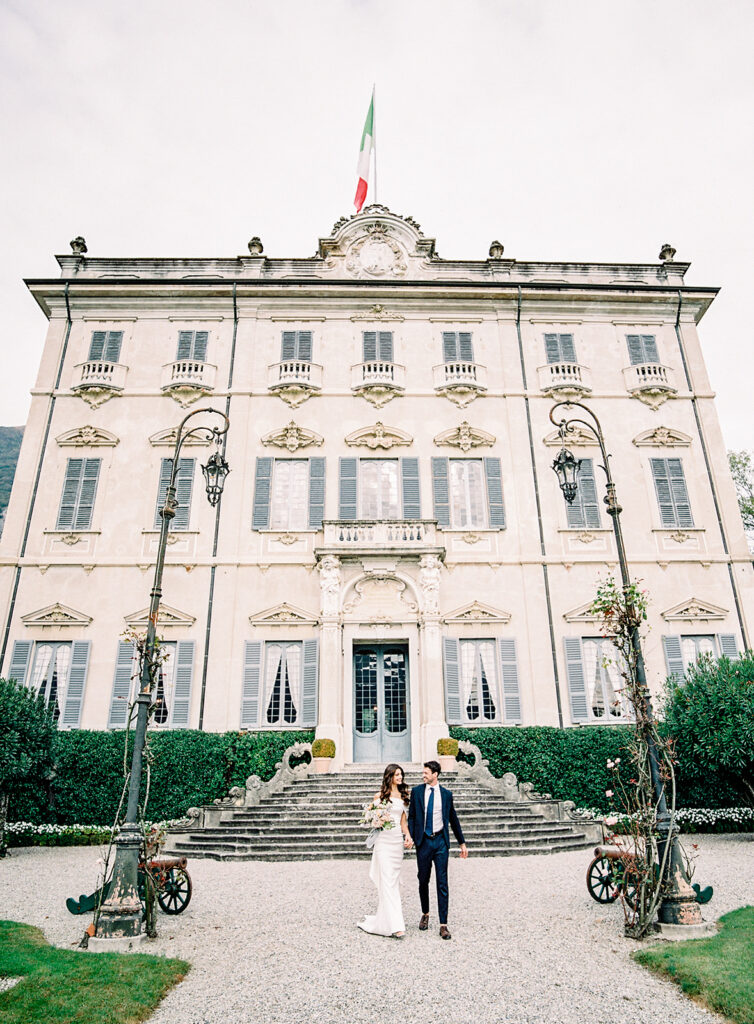 Villa Sola Cabiati Wedding with bride in off the shoulder fitted gown and groom in navy blue suit