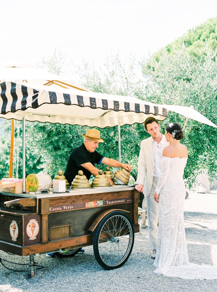 Bride and groom with gelato truck at their Tuscany Wedding at Villa Montanare near Cortona, Italy photographed by Italy wedding photographer 