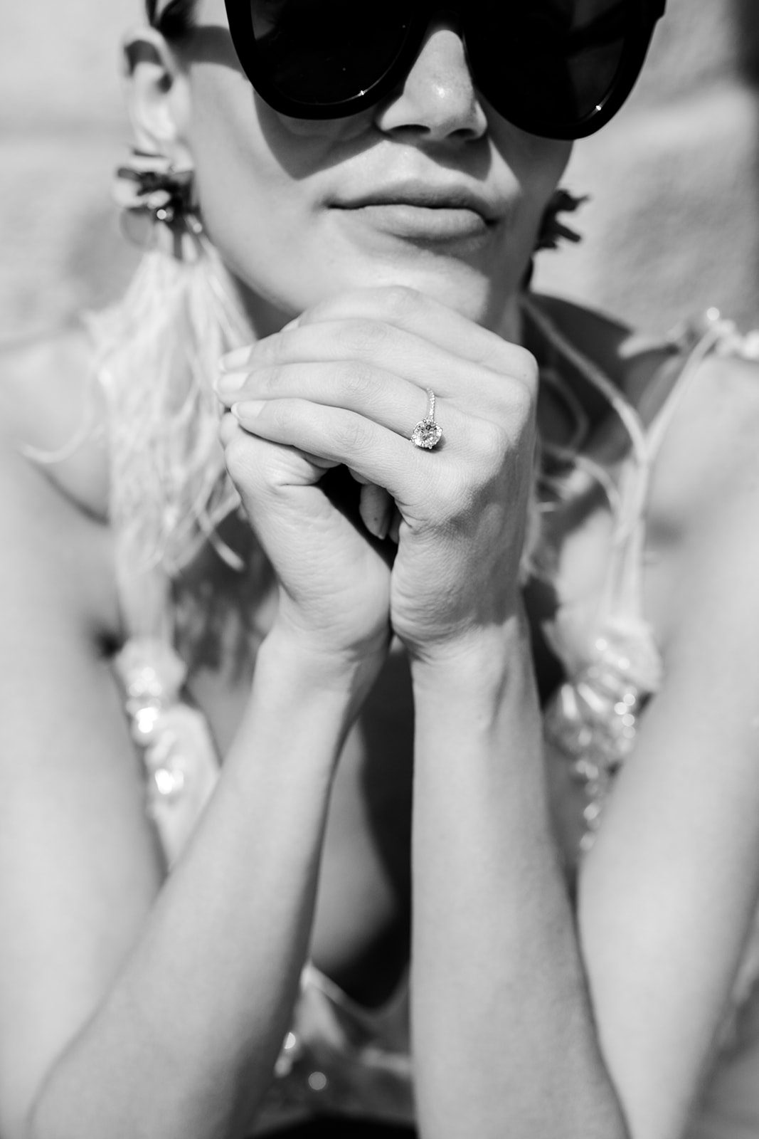 A Paris Engagement Session with bride's engagement ring a 3 carat solitaire round diamond in white gold band with small diamonds filling the band photographed in Paris by Italy wedding photographer