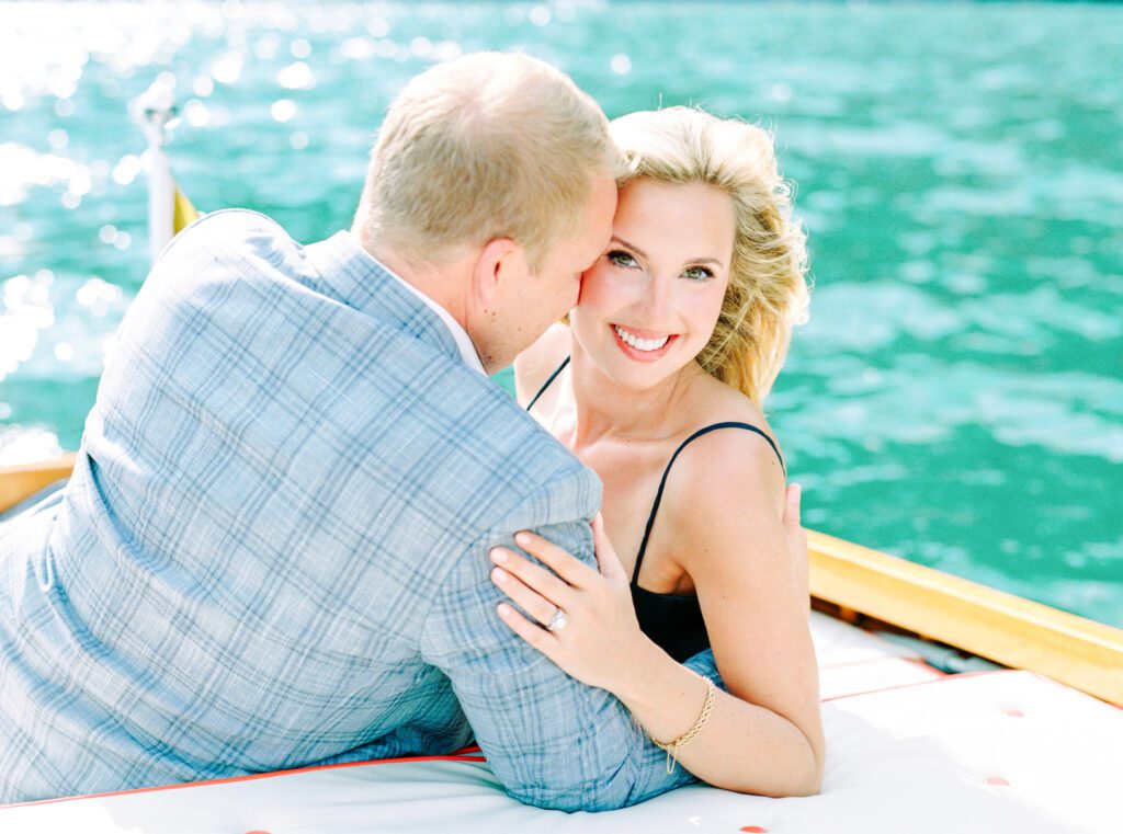 Lake Como Italy engagement session on wooden boat at Passalacqua photographed by Lake Como Photographer