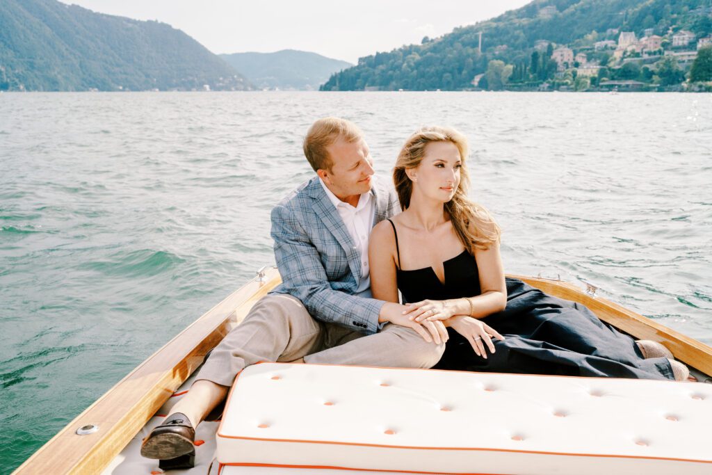 Lake Como Italy engagement session on wooden boat at Passalacqua photographed by Lake Como Photographer