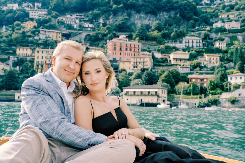 Lake Como Italy engagement session on wooden boat at Passalacqua photographed by Lake Como Photographer