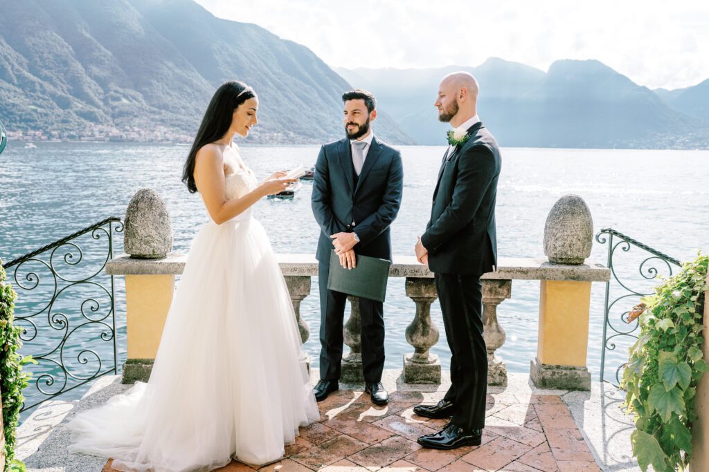 film photograph of bride and groom during their ceremony at Lake Como elopement in Italy at Villa la Cassianella photographed by Lake Como photographer