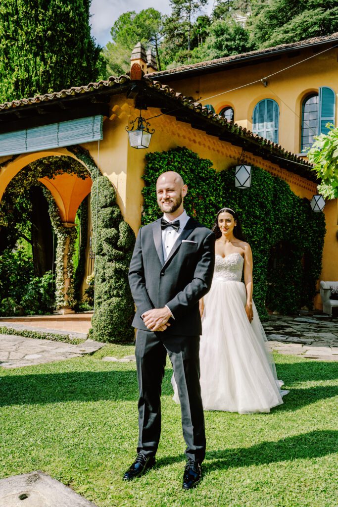 film photograph of bride and groom's first look at Lake Como elopement in Italy at Villa la Cassianella photographed by Lake Como photographer