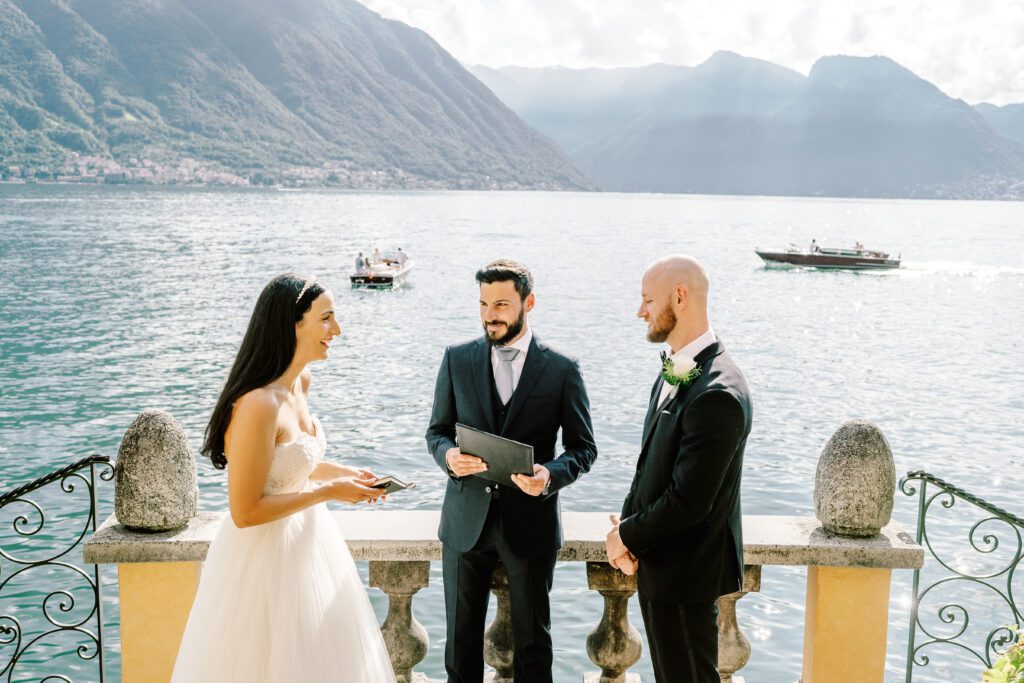 film photograph of bride and groom during their ceremony at Lake Como elopement in Italy at Villa la Cassianella photographed by Lake Como photographer