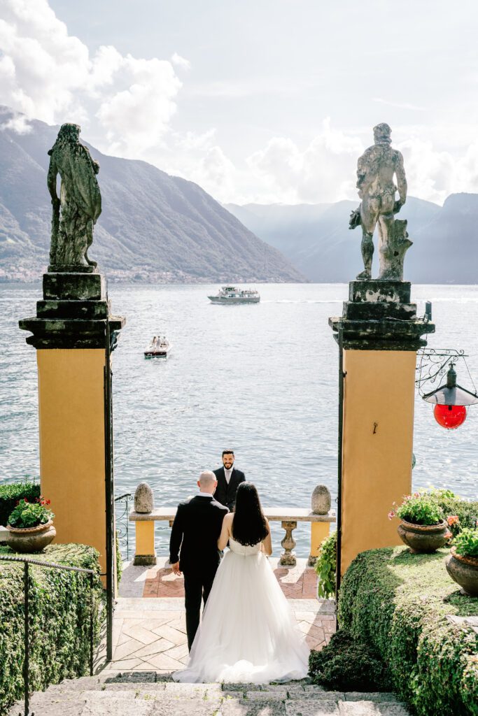 film photograph of bride and groom during their ceremony at Lake Como elopement in Italy at Villa la Cassianella photographed by Lake Como photographer