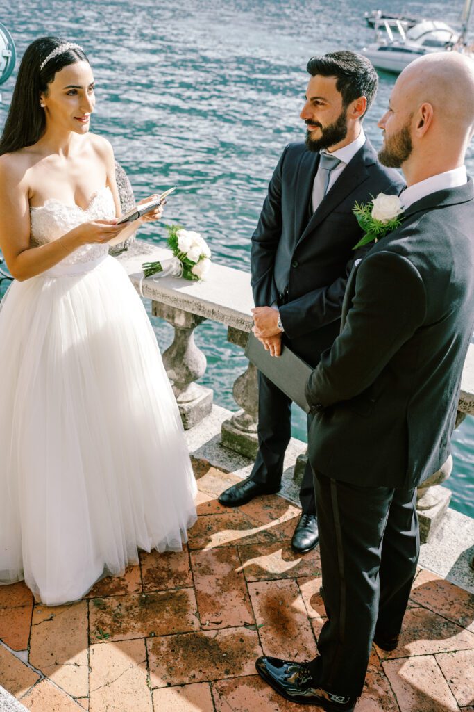 film photograph of bride and groom during their ceremony at Lake Como elopement in Italy at Villa la Cassianella photographed by Lake Como photographer