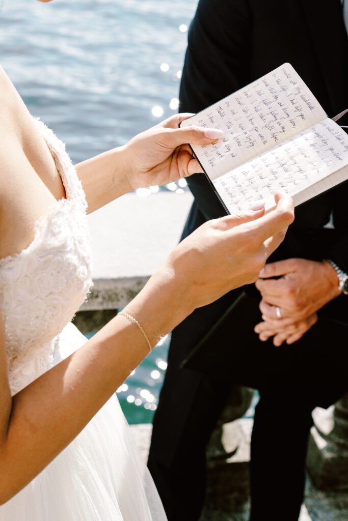 film photograph of bride and groom during their ceremony at Lake Como elopement in Italy at Villa la Cassianella photographed by Lake Como photographer