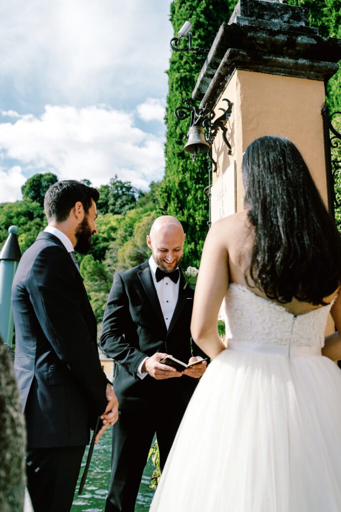 film photograph of bride and groom during their ceremony at Lake Como elopement in Italy at Villa la Cassianella photographed by Lake Como photographer