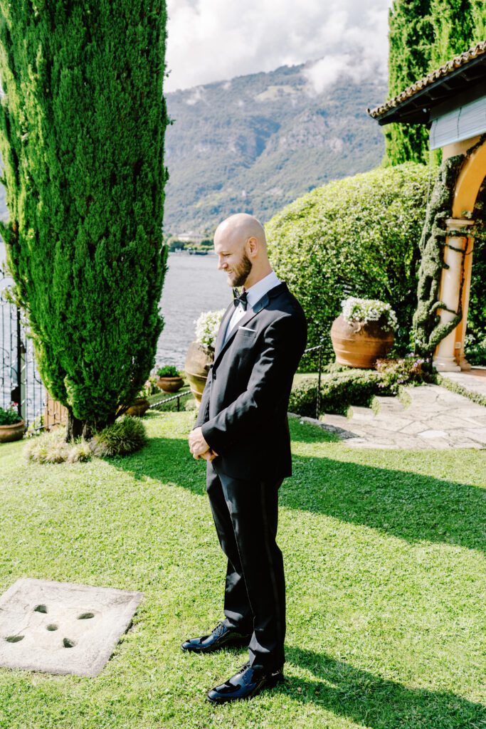 film photograph of bride and groom's first look at Lake Como elopement in Italy at Villa la Cassianella photographed by Lake Como photographer