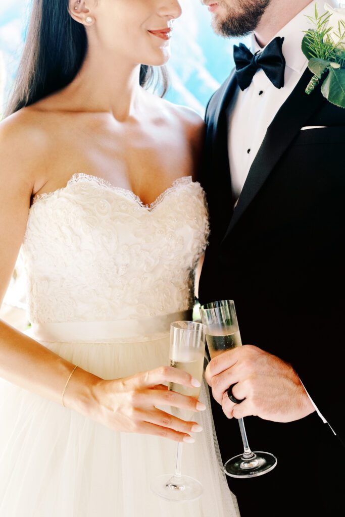 film photograph of bride and groom during their cake cutting at Lake Como elopement in Italy at Villa la Cassianella photographed by Lake Como photographer