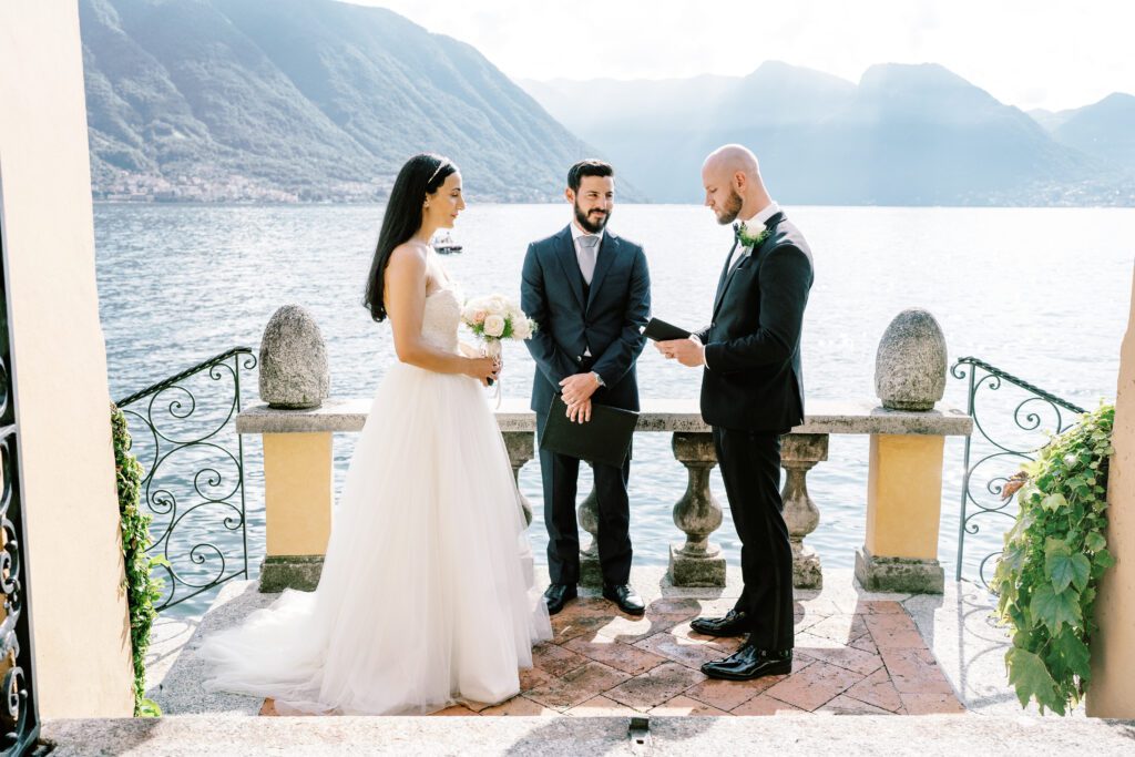 film photograph of bride and groom during their ceremony at Lake Como elopement in Italy at Villa la Cassianella photographed by Lake Como photographer