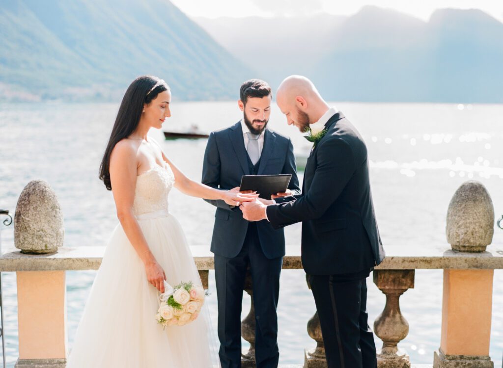 film photograph of bride and groom during their ceremony at Lake Como elopement in Italy at Villa la Cassianella photographed by Lake Como photographer