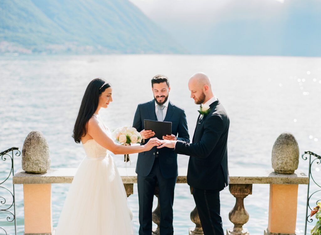 film photograph of bride and groom during their ceremony at Lake Como elopement in Italy at Villa la Cassianella photographed by Lake Como photographer