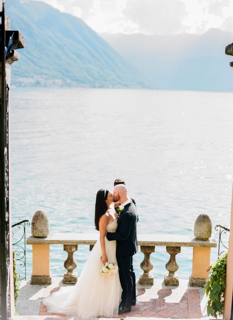 film photograph of bride and groom during their ceremony at Lake Como elopement in Italy at Villa la Cassianella photographed by Lake Como photographer