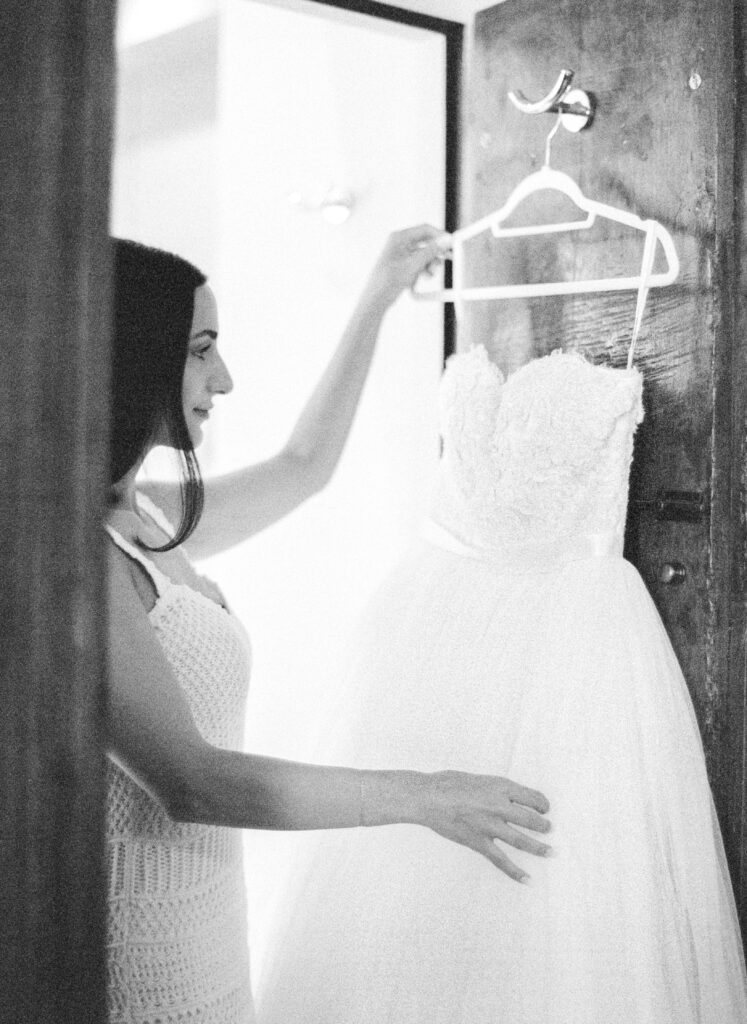 Black and white film photograph of bride getting ready for her Lake Como elopement in Italy at Villa la Cassianella photographed by Lake Como photographer