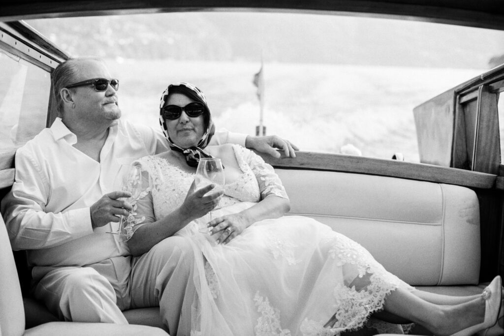 Lake Como Anniversary session on wooden boat photographed by Lake Como photographer