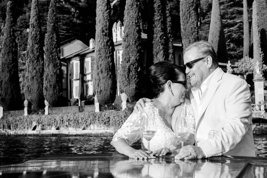 Lake Como Anniversary session on wooden boat photographed by Lake Como photographer