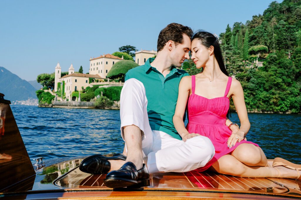 Barbie fashion inspired Lake Como engagement session at Grand Hotel Tremezzo wooden boat photographed by Lake Como photographer