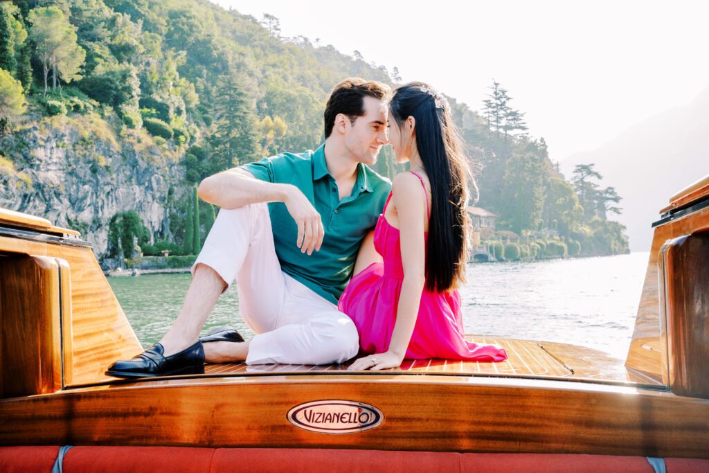 Barbie fashion inspired Lake Como engagement session at Grand Hotel Tremezzo wooden boat photographed by Lake Como photographer