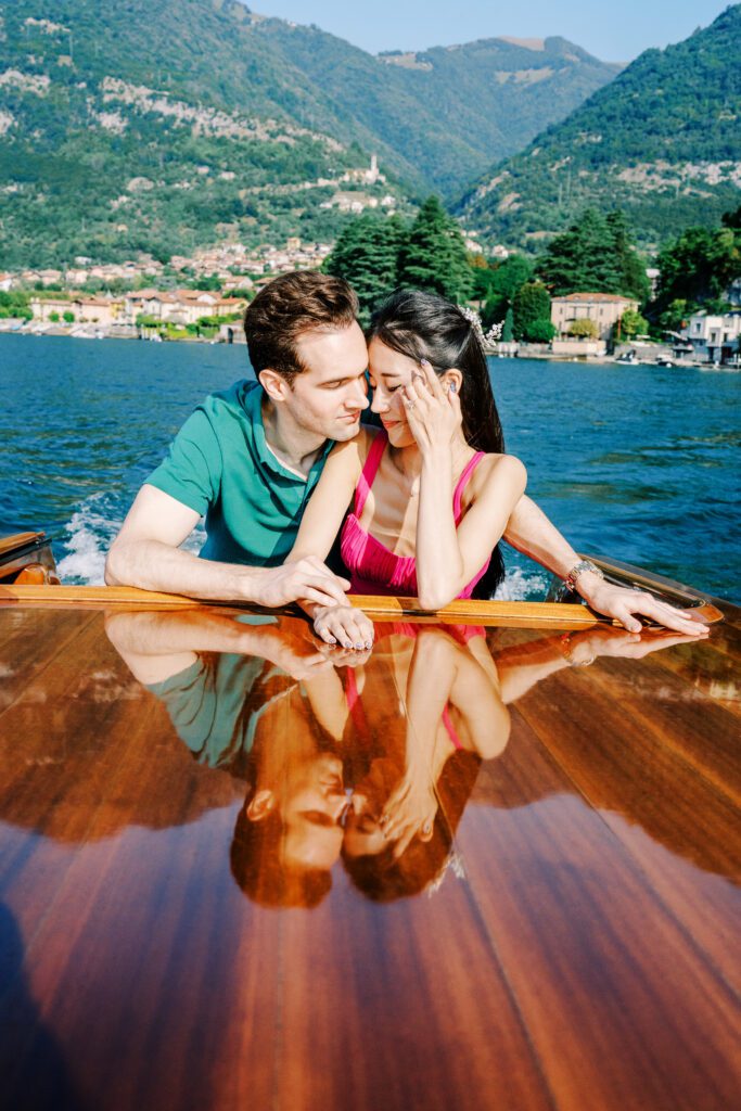 Barbie fashion inspired Lake Como engagement session at Grand Hotel Tremezzo wooden boat photographed by Lake Como photographer