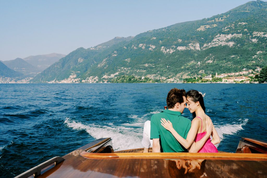 Barbie fashion inspired Lake Como engagement session at Grand Hotel Tremezzo wooden boat photographed by Lake Como photographer