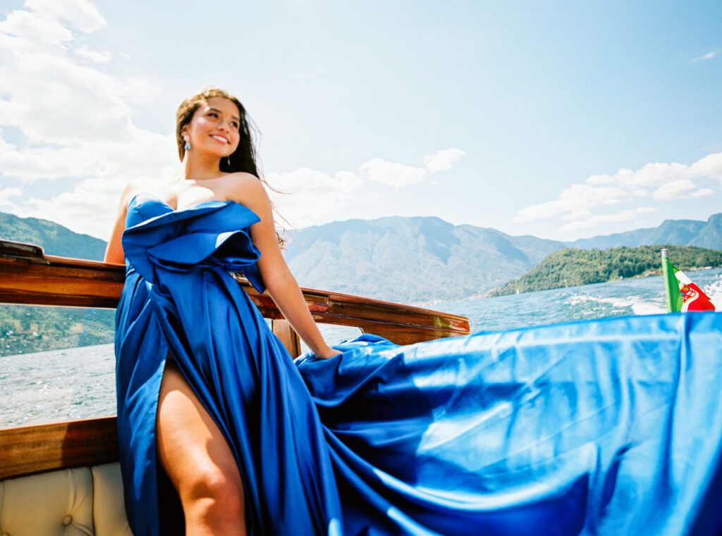 Quinceañera on wooden boat on Lake Como in Italy photographed by Lake Como photographer