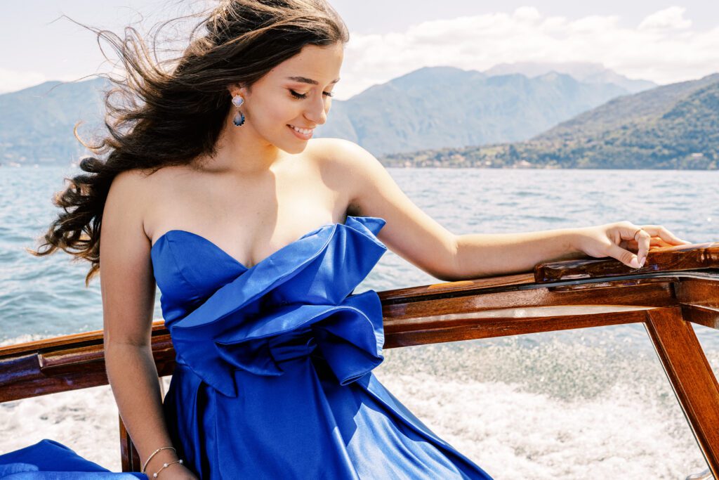 Quinceañera on wooden boat on Lake Como in Italy photographed by Lake Como photographer