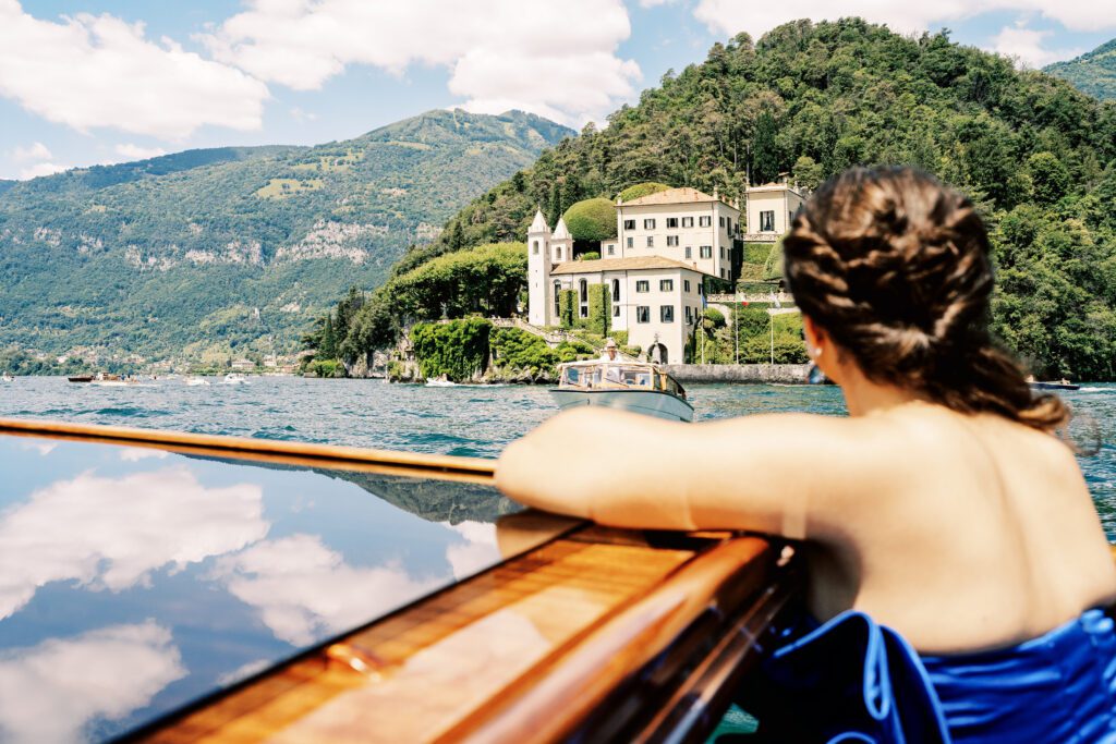 Quinceañera on wooden boat on Lake Como in Italy photographed by Lake Como photographer