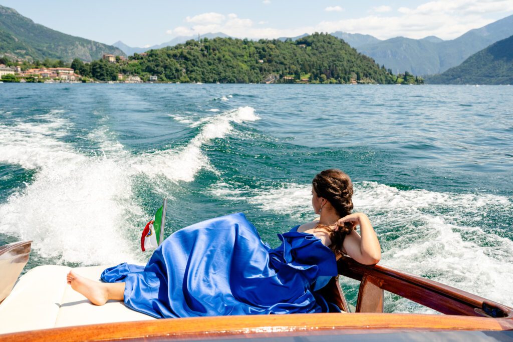 Quinceañera on wooden boat on Lake Como in Italy photographed by Lake Como photographer